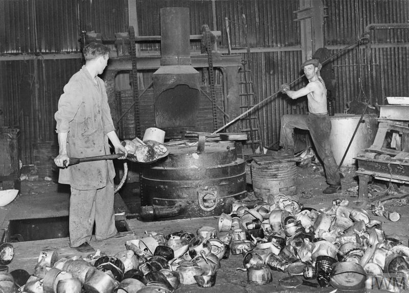 Workers processing aluminum pans